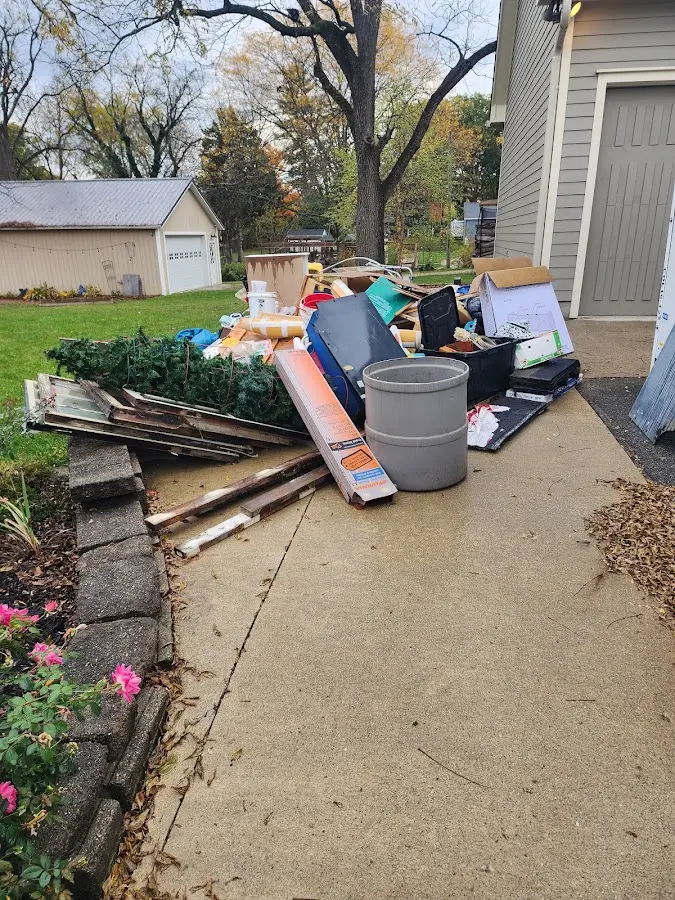 Dumpster being loaded with debris for Residential Dumpster Rental in Wallace
